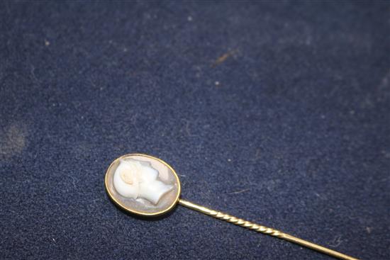 A 19th century yellow metal and sardonyx oval cameo stick pin, carved with the bust of Hermes to sinister, signed in Greek,